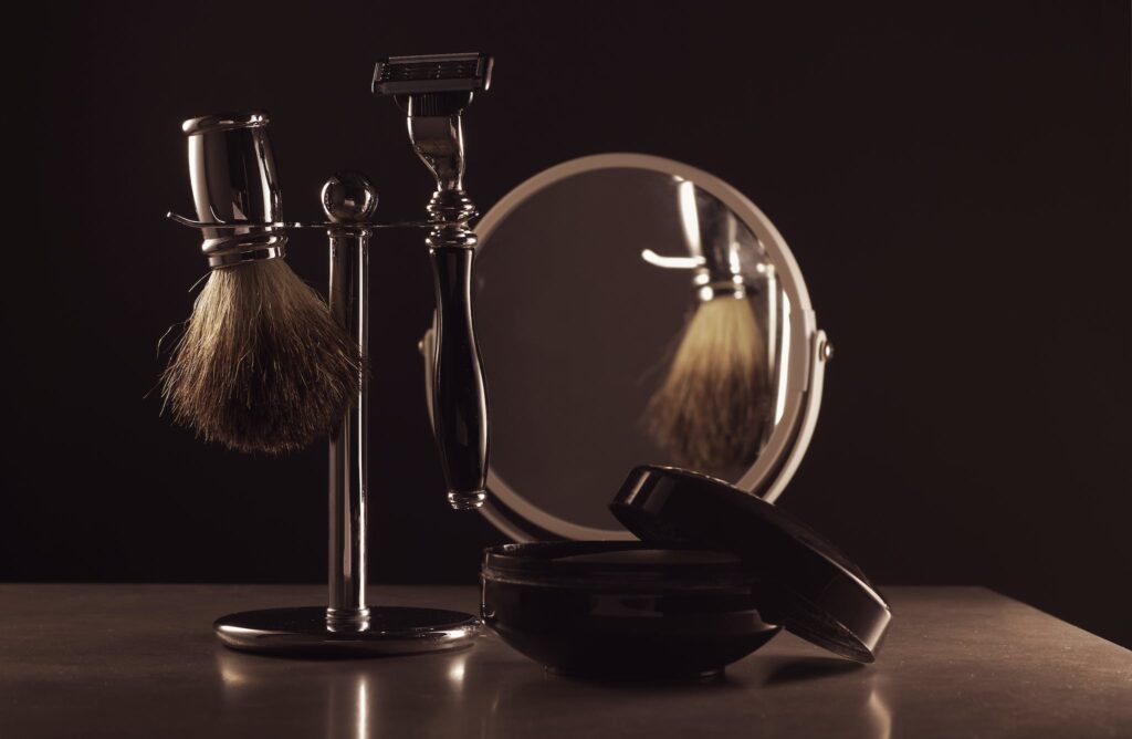 Beard Grooming Tools and Mirror on Table