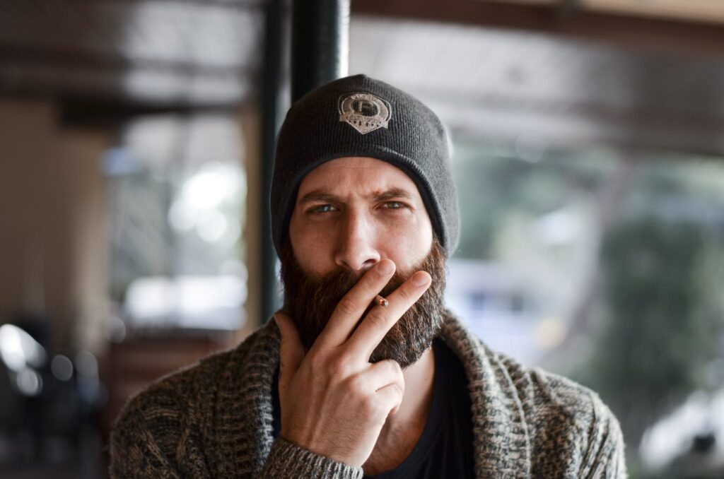 Man Smoking Cigarette Stick with large beard